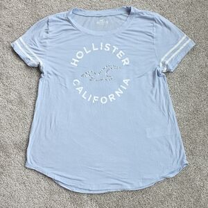 Hollister Light Blue Graphic Tee with White Stripe Sleeves - Women